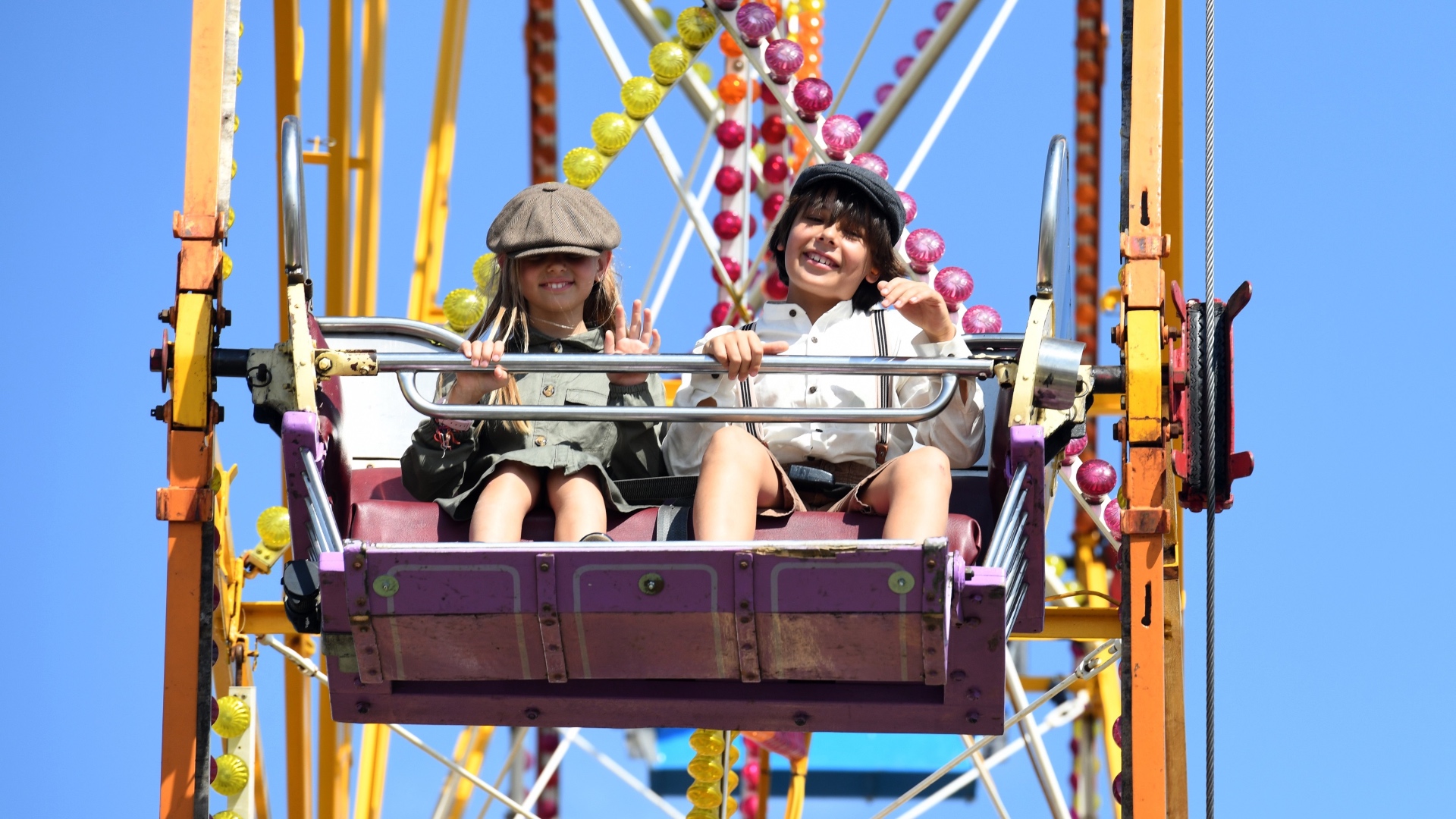 Visitors enjoying the funfair at the 2023 Goodwood Revival. Ph. by PA.