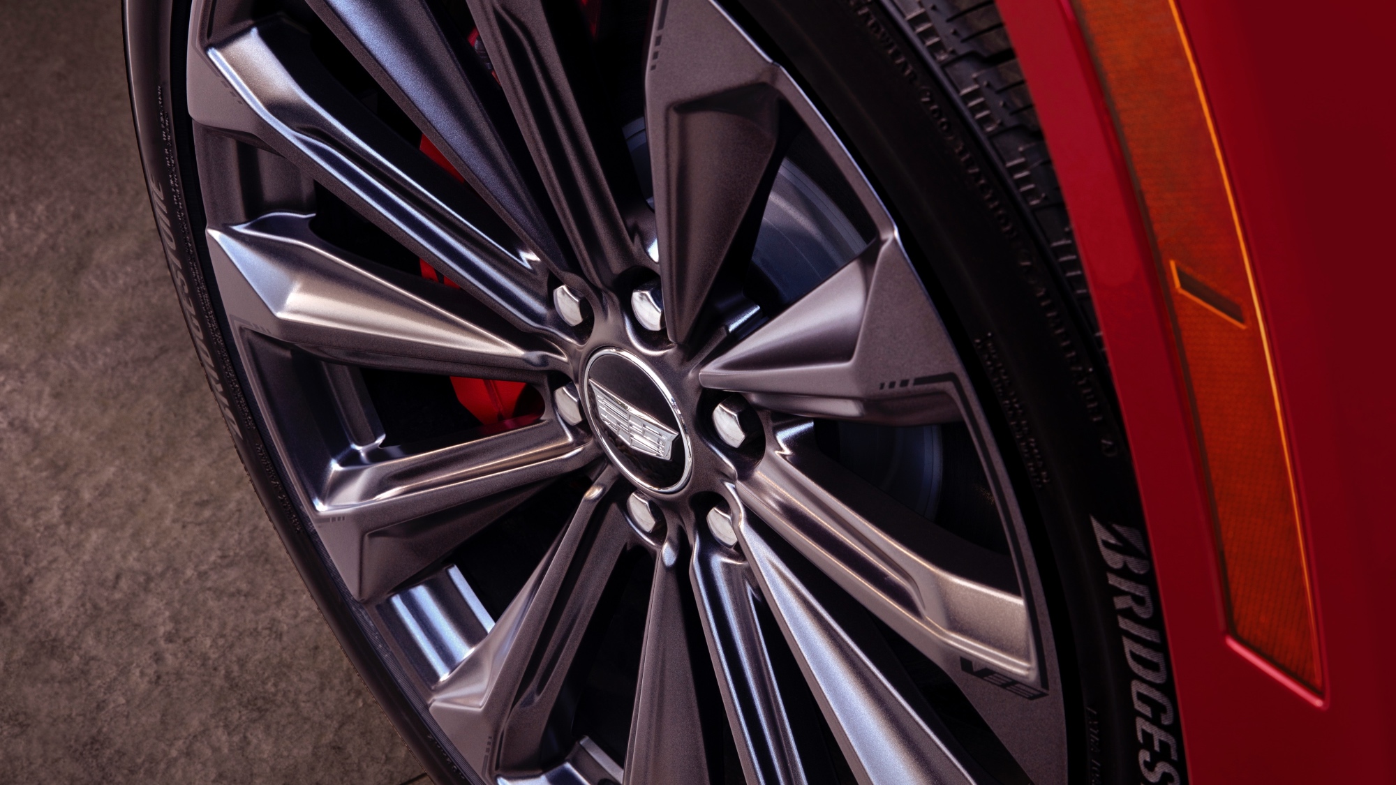 Close-up view of the 2025 Cadillac Escalade-V’s wheel and tire. Close-up view of the 2025 Cadillac Escalade-V’s wheel and tire.