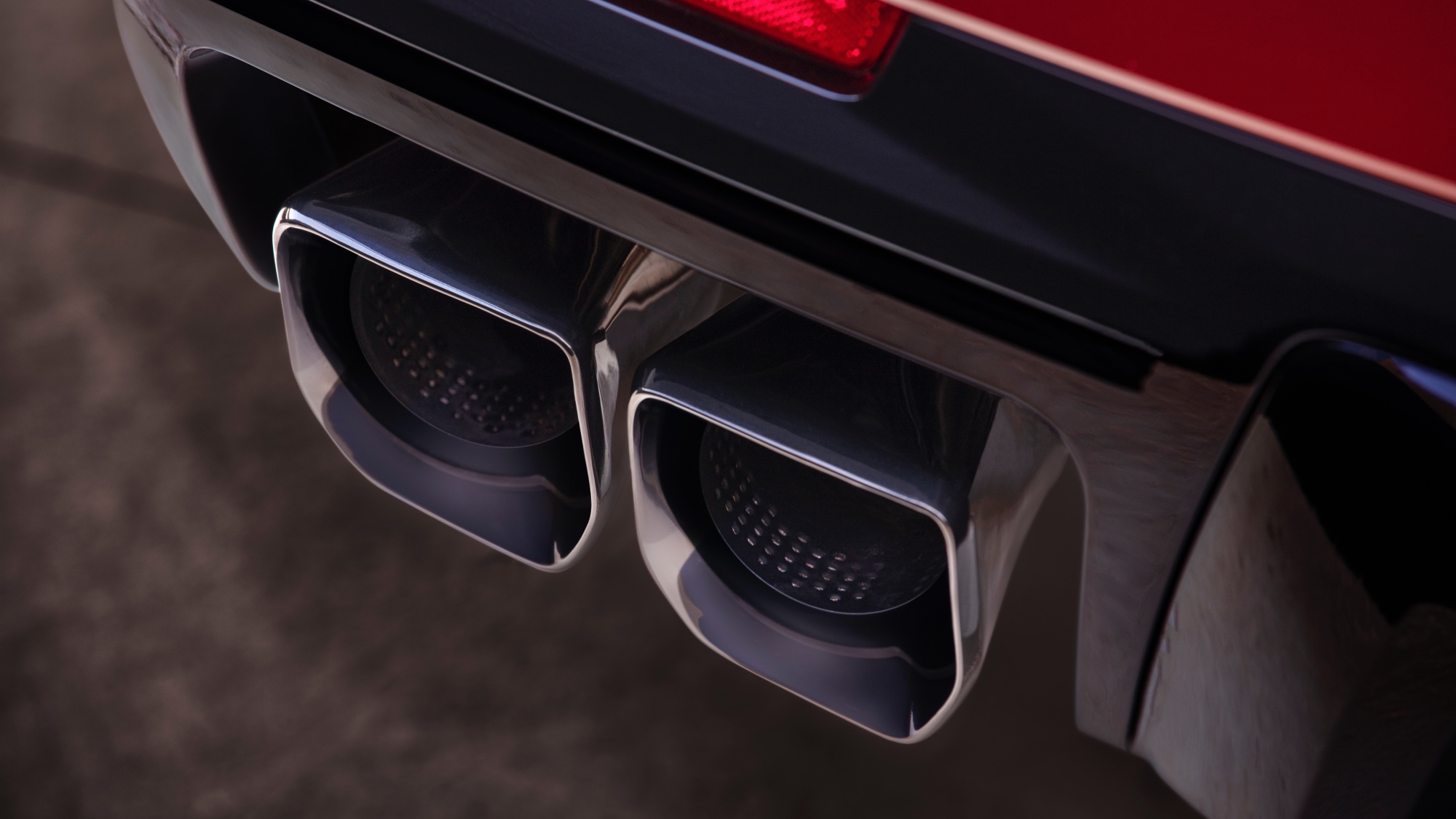 Close-up view of the 2025 Cadillac Escalade-V’s exhaust. Close-up view of the 2025 Cadillac Escalade-V’s exhaust.